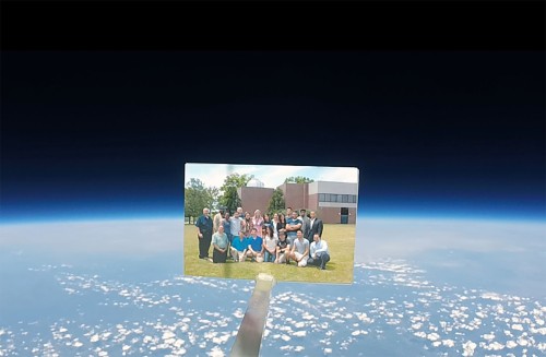 STEM students and faculty attached a photograph of themselves to the high altitude balloon.